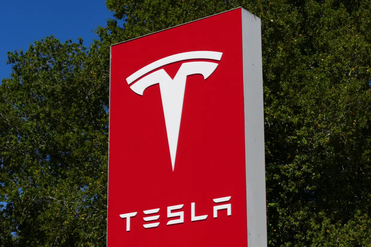 What companies are partnering with Tesla?